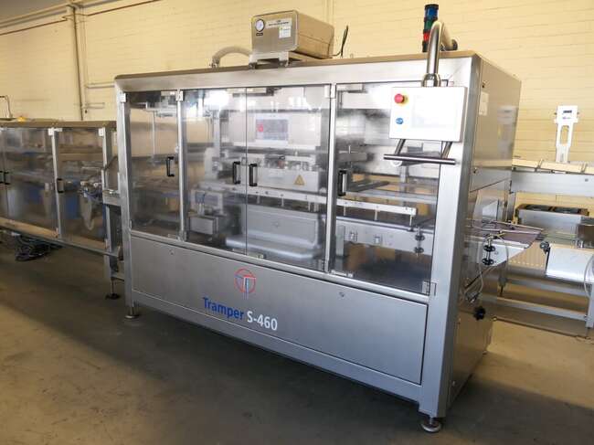 Tramper filling- and traysealing line